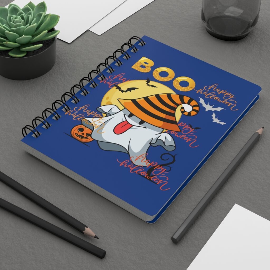 Halloween Boo spiral bound journal on desk featuring cute ghost and witch hat Halloween cover