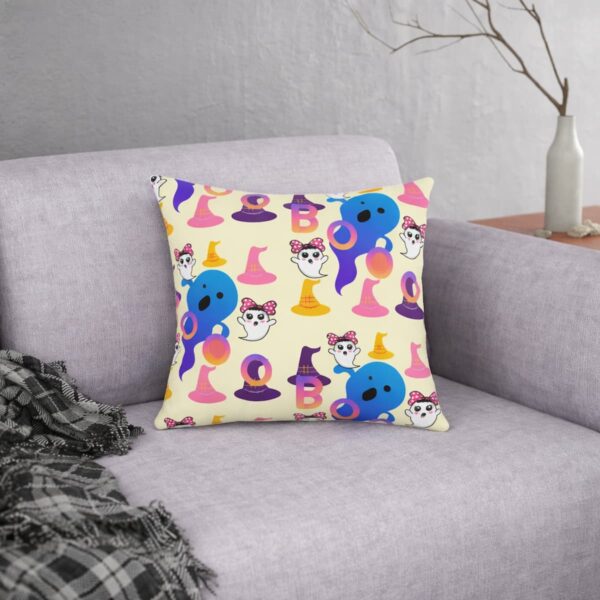 Colorful Boo waterproof pillows with playful ghost and witch hat pattern displayed on a modern sofa