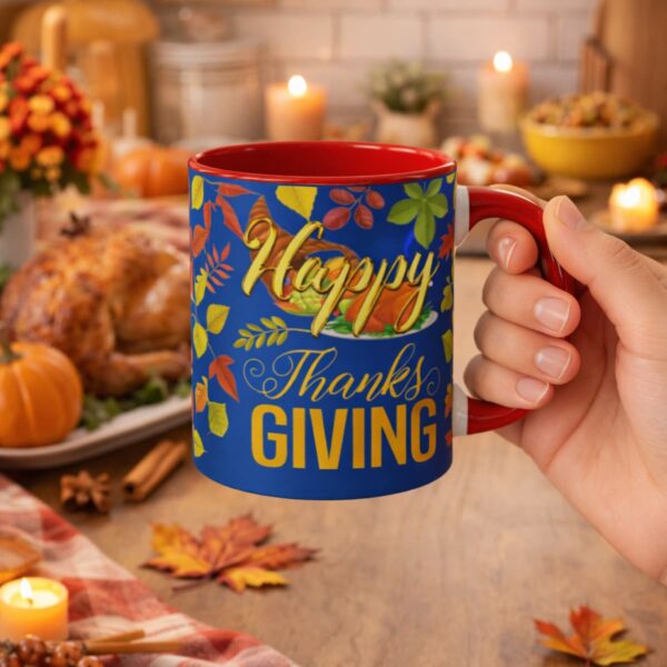 Happy Thanksgiving accent coffee mug held in hand in a cozy festive kitchen setting with roasted turkey, pumpkins, candles, and warm autumn decor