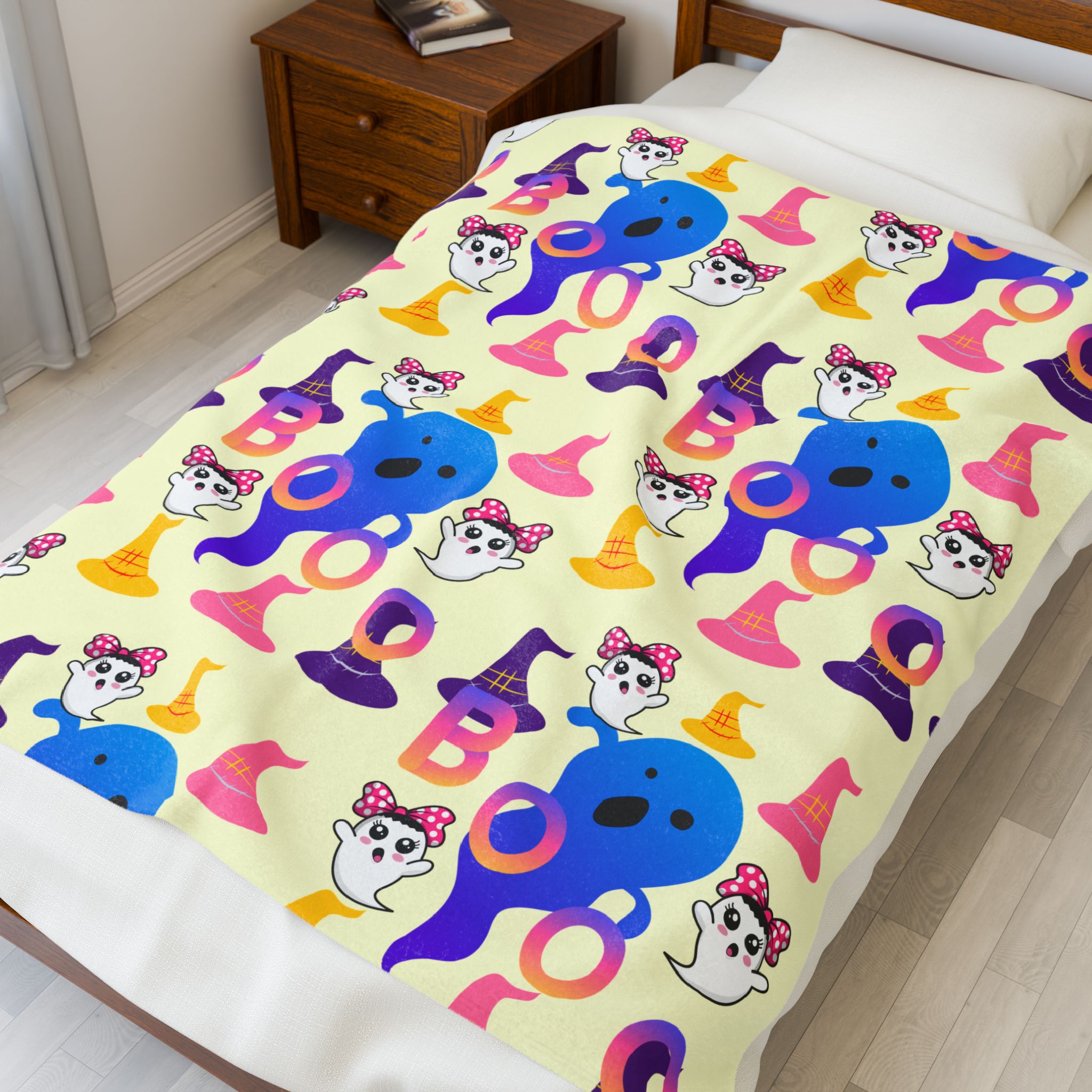 Colorful Boo plush blanket 50x60 on bed showing cute ghost Halloween pattern